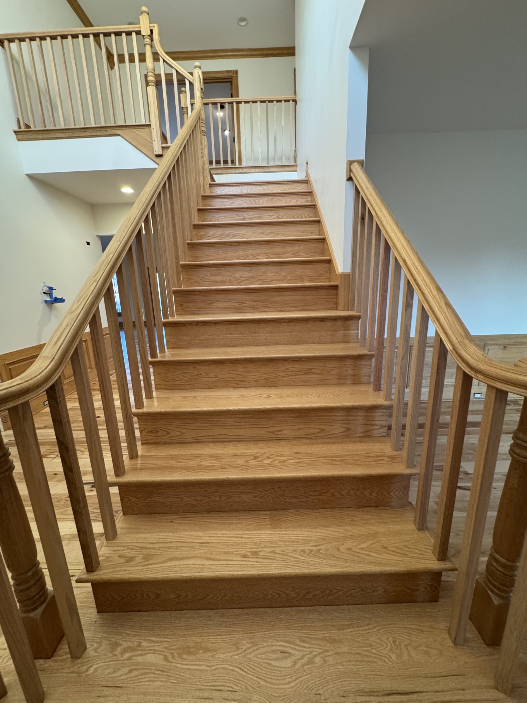 Custom oak staircase installation with railings