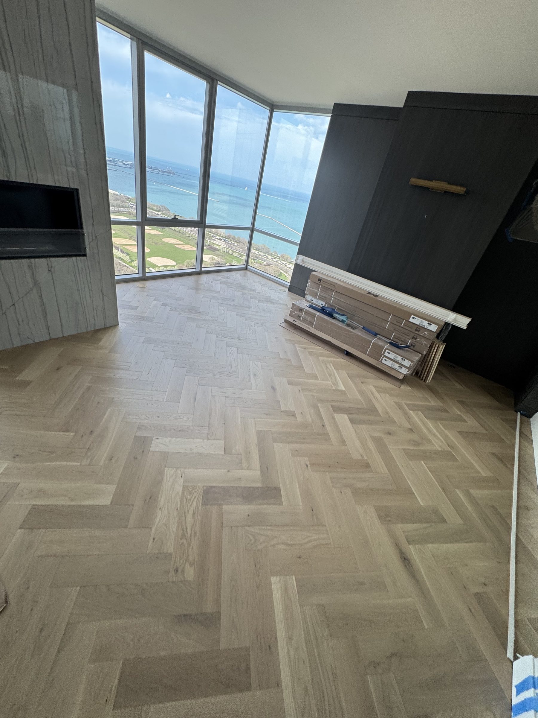 Herringbone hardwood with fireplace and lake Michigan view