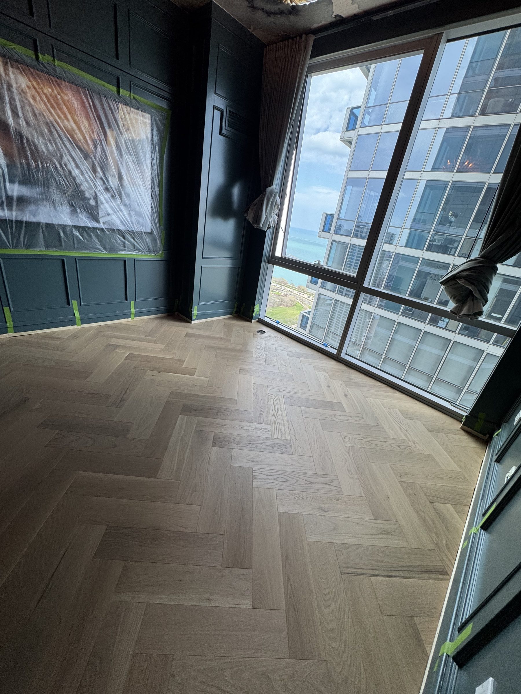 White oak herringbone living room downtown Chicago condo