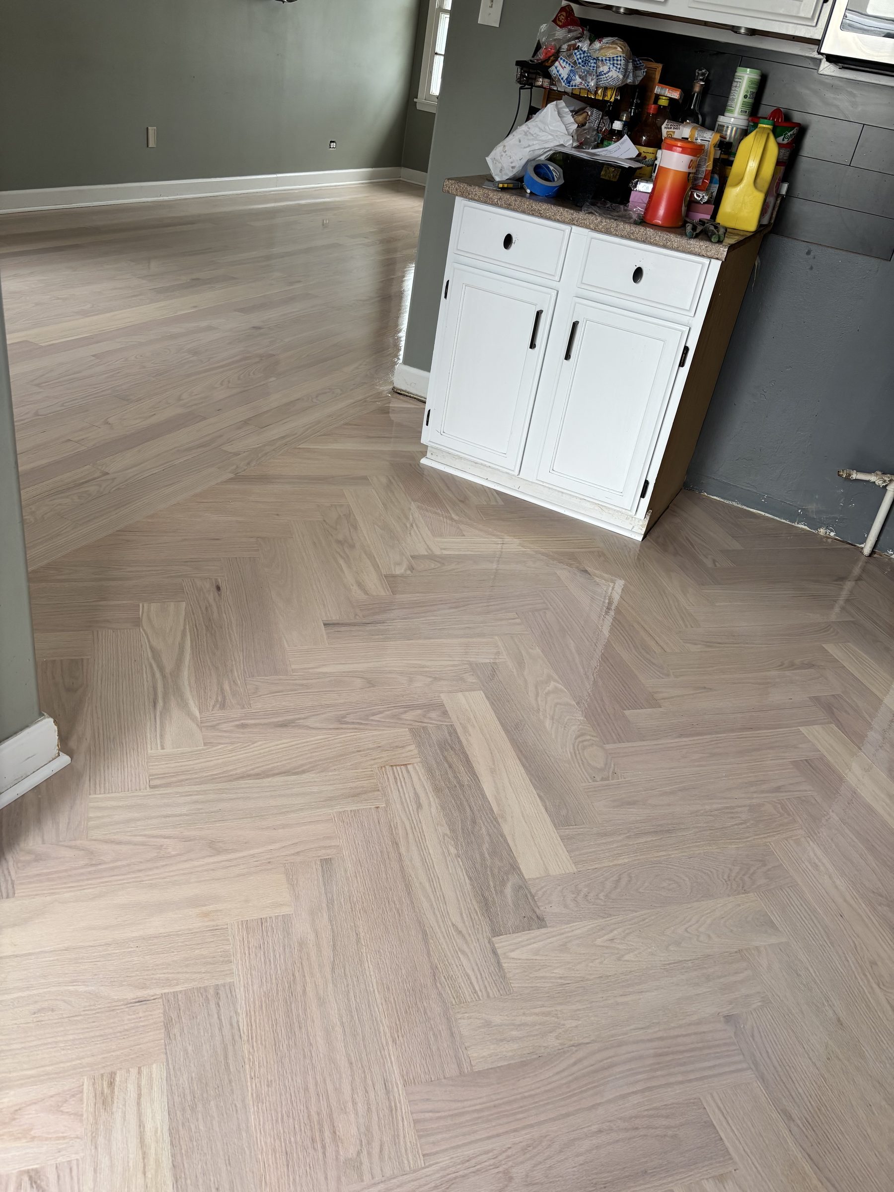 Herringbone hardwood floor with kitchen island